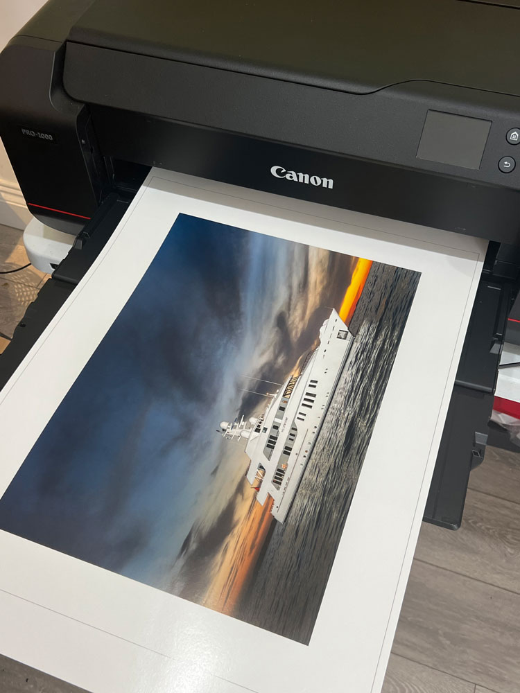 A print of a yacht coming out of a printer